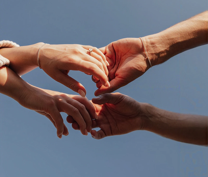Hands reaching together